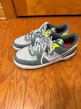 Nike Gray Low-Top Sneakers with Neon Yellow and Blue Accents